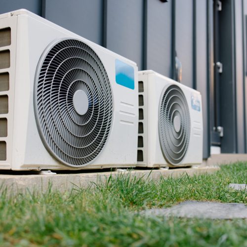 Outdoor air conditioning units providing climate control for a modern residential or commercial building